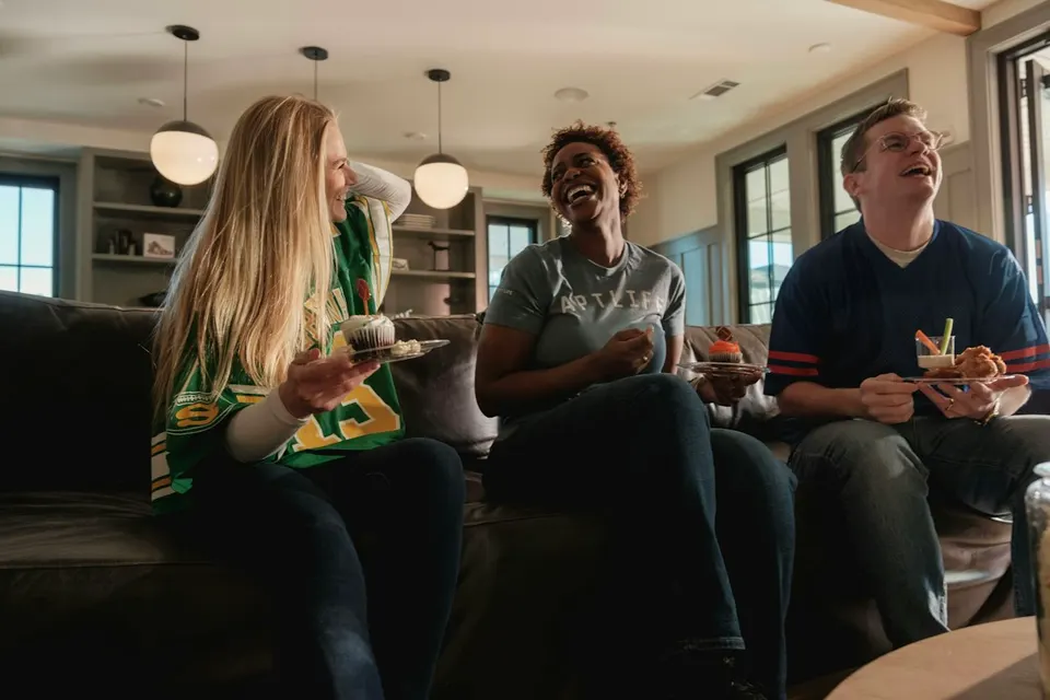 Friends playing a game together at home